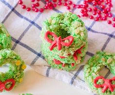 green rice krispy kreme wreaths with red bows and candy candies