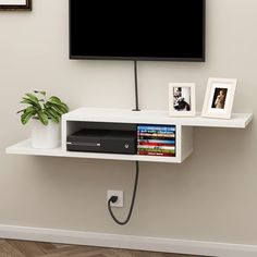 PRICES MAY VARY. 【Unique Asymmetrical Design】This wall TV stand with an attractive unique asymmetrical design, wall-mounted use can save room space. The wire holes are designed keep your standtop neatly organized. 【Stable and Reliable】This wood TV stand with high MDF material, a uniform structure, which makes it sturdy, waterproof and easy to clean. 【Multipurpose Use】The media console is a suitable living room bedroom or home office for storage electronic devices such as routers, set-top boxes, Mounted Tv Decor Bedroom, Mounted Tv Ideas Bedroom, Mounted Tv Bedroom, Mounted Tv Decor, Tv Stand Shelf, Twin Boys Room, Floating Shelf Under Tv, Wall Mount Tv Shelf, Console For Living Room