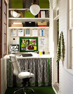 a home office with green and white decor