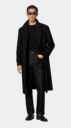 Tailored to a knee length, this black overcoat features a wide peak lapel and natural shoulders. With its double-breasted closure, inside pockets, and a martingale belt, it ensures both style and practicality. Perfect White Shirt, Tuxedo Accessories, Black Overcoat, Black Tie Formal, Flannel Suit, Custom Made Suits, Peacoats, Tuxedo Shirts, Classic Suit