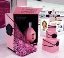 a display in a store with pink and black boxes