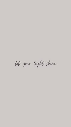 the words let your light shine are written in black ink on a gray background with a white