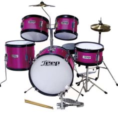 a pink drum set with cycs and drumsticks on the bottom, sitting in front of a white background