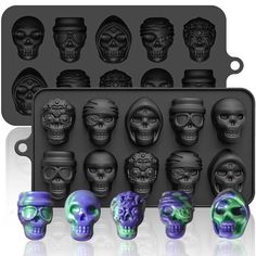 an assortment of skull molds with different colors and shapes on them, including skulls