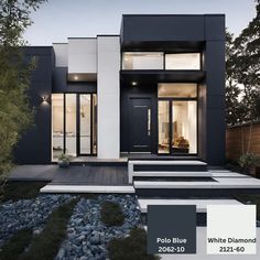 a modern house with black and white exterior color scheme for the front door, windows, and steps