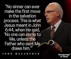 a man in a suit and tie holding a book with a quote from john mccain on it