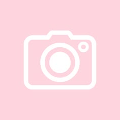 an image of a camera on a pink background