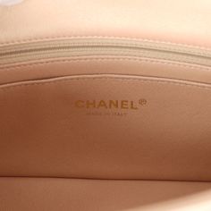 This Chanel mini classic rectangular flap bag is of iridescent beige lambskin leather with light gold tone hardware and has a front flap with signature CC turnlock closure, rear half moon pocket, single interwoven iridescent beige leather and light gold chain link shoulder/crossbody strap.The interior is lined in iridescent beige leather and features a zipper pocket with Chanel pull and an open pocket below.Collection: 22C (RFID Chip)Origin: FranceCondition: New and never worn (plastic on hardware)Accompanied by: Chanel box (damaged), Chanel dustbag, felt and COA cardMeasurements: 8" width x 5" height x 2.5" depth; 20" strap drop Chanel Mini Rectangular, Chanel Box, Mini Classic, Chanel Mini, Bottega Veneta Shoulder Bag, Exclusive Bag, Flap Bag, Debit Card, Lambskin Leather