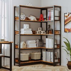 a book shelf filled with lots of books next to a potted plant and clock