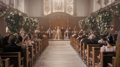 the wedding ceremony is being held in an old church