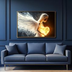 a living room with blue walls and an angel painting on the wall above a couch