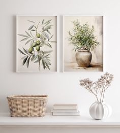 two paintings on the wall above a white shelf with flowers and plants in vases