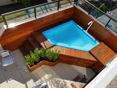 an above ground pool surrounded by wooden decking