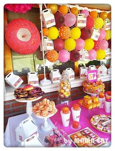 an assortment of desserts and pastries displayed on a table