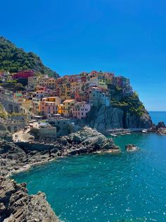 colorful houses on the cliff above the water