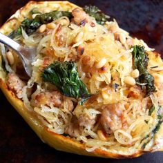 a close up of a stuffed squash with meat and veggies