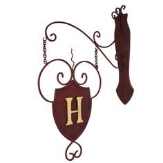 a red and gold sign with the letter h hanging from it's side