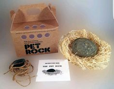 a box with a rock in it next to some string