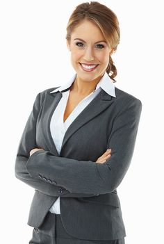 a woman in a business suit with her arms crossed