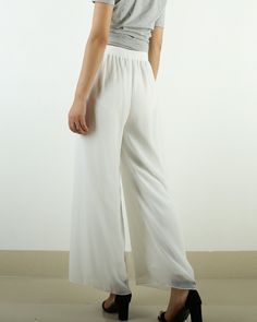 * A wide leg pants with elastic waist, made with beautiful pearl chiffon pants, very comfortable to wear, not easy to get wrinkled, very easy to take care of. * Material: outer-pearl chiffon, lining-100% polyester Custom made to fit, lead time is 6-8 days; Let us know your usual size in your country and your overall height. If you have some specific request or special characters such as broad shoulder, long arms, long waist, etc you think we need pay attention to when making, do let me know. * C Elegant Summer Wide-leg Culottes, Elegant Wide Leg Full Length Pants With Elastic Waistband, Elegant Wide Leg Pants With Elastic Waistband, Chic Wide Leg Pants With Elastic Waistband For Spring, Non-stretch High-waisted Wide Leg Pants With Elastic Waistband, Elegant Wide-leg Pants With Elastic Waistband, Elegant Relaxed Fit Culottes For Spring, Chic Wide-leg Culottes For Summer, Chic Wide Leg Culottes For Summer