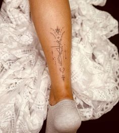 a woman with a tattoo on her leg