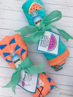 three watermelon and blue bottles wrapped in fabric