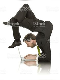 a man in suit and tie using a laptop computer royalty photo