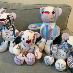 several stuffed animals are sitting on a couch