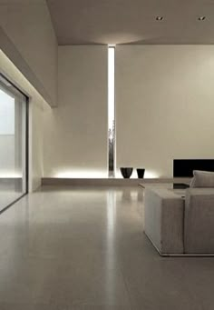 an empty living room with yellow walls and white flooring is pictured in this image