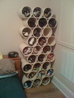 there is a large stack of cups on the wall