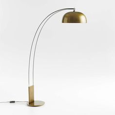 a floor lamp with a metal base and an oval light fixture on the side, against a white background