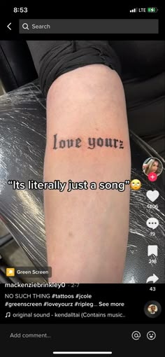 a person with a tattoo on their arm that reads love your it's literally just a song