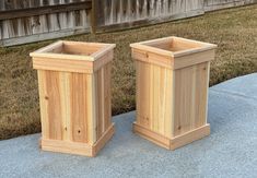 two wooden planters sitting next to each other