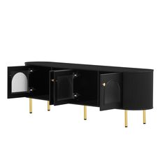 a black cabinet with gold legs and two doors on each side, one door open