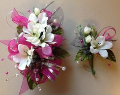 two bridal bouquets with pink ribbons and white flowers on the top one is purple