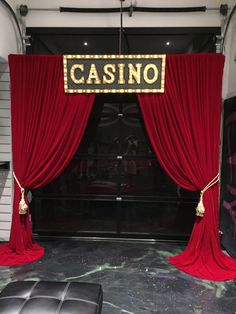 the entrance to a casino with red curtains