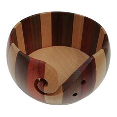 a wooden bowl that is shaped like an animal