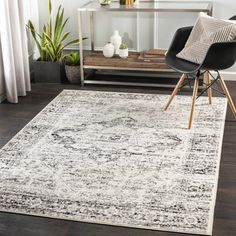 a white rug with black and grey accents