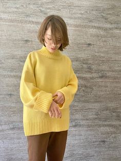 Yellow turtleneck sweater for women. Oversized nordic hygge sweater.  Loose merino wool sweater.  Fluffy hand knit sweater with high neck. Extraordinary soft turtleneck sweater for Her. Radiant yellow sweater is the Best gift for the woman you love. Made of luxurious Italian blend of 80% merino and 20% viscose. Suitable for sizes XS-XL Width: 22.4"/57 cm Length: 25.2"/64 cm Sleeve: 20.8"/53 cm Colors can differ because of the personal screen color reception.  If you want other color, please DM for custom order. This item is hand made. Please, allow 1-2 weeks to knit and sent it you. Will be shipped within 1-2 weeks by airmail. Tracking will be available. Your order will be packed securely into a carton box. We provide eco-packing. Handwash only. Dry flat. Steam. Do not bleach. Do not iron. Sweater 4 Pack, Luxury Solid Wool Turtleneck, Luxury High Neck Turtleneck In Merino Wool, Luxury Yellow Winter Sweater, Cheap Cozy Yellow Sweater, Cheap Stretchable Yellow Sweater, Yellow Turtleneck, Hand Knit Sweater, Womens Pullover Sweaters