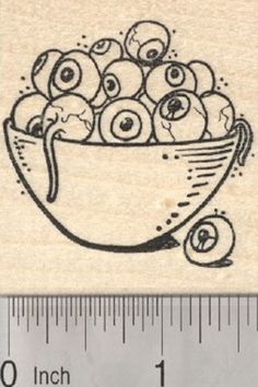 a rubber stamp with an image of apples in a bowl