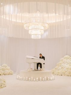 Piano and pianist at white wedding with with draping and chandelier. Musician is on a small round platform and surrounded in candles. Dream Wedding Reception, Bridal Trends, Dinner Party Decorations, Indoor Wedding Ceremonies, White Wedding Theme, Luxury Wedding Decor, Ceremony Music