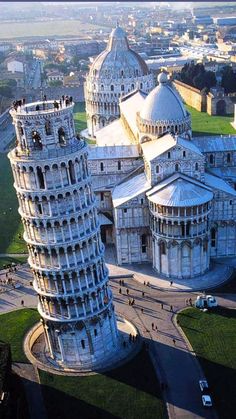 an aerial view of the leaning tower of pisa in italy, looking down on the city