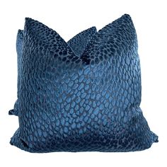 a blue snake skin pillow on a white background