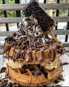 a giant waffle covered in chocolate and bananas