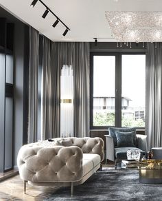 a living room filled with furniture and a chandelier