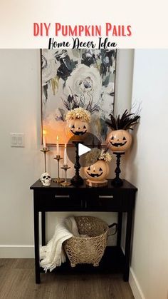 a black table with pumpkins and candles on it in front of a painting that reads diy pumpkin pals home decor idea