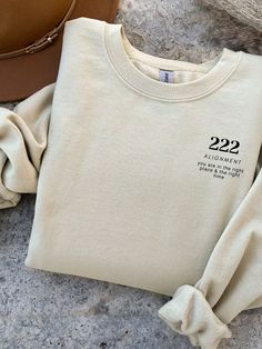 Angel number 222 with inspirational quote is a heavy blend crewneck sweatshirt is pure comfort. This sweatshirt is true to size and made from polyester and cotton. The collar is ribbed knit, so it retains its shape even after washing. There are no itchy side seams on this sweatshirt so it's great for the winter making this angel number 222 sweatshirt a great gift this year for Birthday or Christmas stocking filler. Angel Numbers Sweatshirt, Merchandise Ideas Clothing, Brand Merchandise Ideas, Crewneck Design Ideas, 333 Angel Numbers, 444 Angel Numbers, Crewnecks For Women, Hoodies With Sayings, Affirmation Clothing