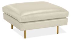 a white ottoman with gold legs and a footstool on an isolated white background