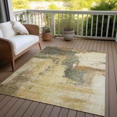 an area rug on a deck with chairs and potted plants