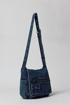 Essential messenger bag crafted from premium BDG denim. Low-profile silhouette with a pocketed flap closure. Lined interior with two pockets and plenty of space for your essentials. Complete with a zip pocket at the back for easy access, plus a water bottle pocket at the side. Finished with an adjustable strap - wear it on your shoulder or crossbody. Urban Outfitters exclusive. Features BDG denim messenger bag Washed soft denim with tons of storage Plenty of pockets inside and out Water bottle p Denim Messenger Bag, Funky Purses, Denim Diy Clothes, Shoulder Bag Outfit, Sick Clothes, Adjustable Bag Strap, My Style Bags, Crossbody Bag Fashion